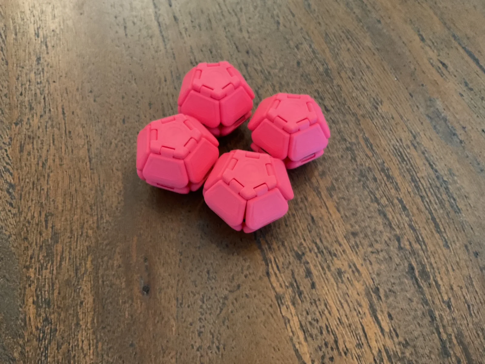 Pink Pentaclicks opened into a five-sided ring